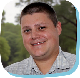 Headshot of Sean Hynes, a white man in his forties with short hair